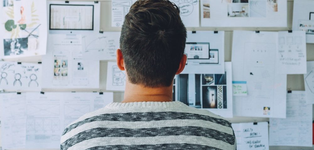 A man look in a notice board