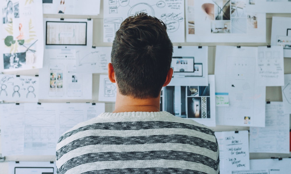 A man look in a notice board